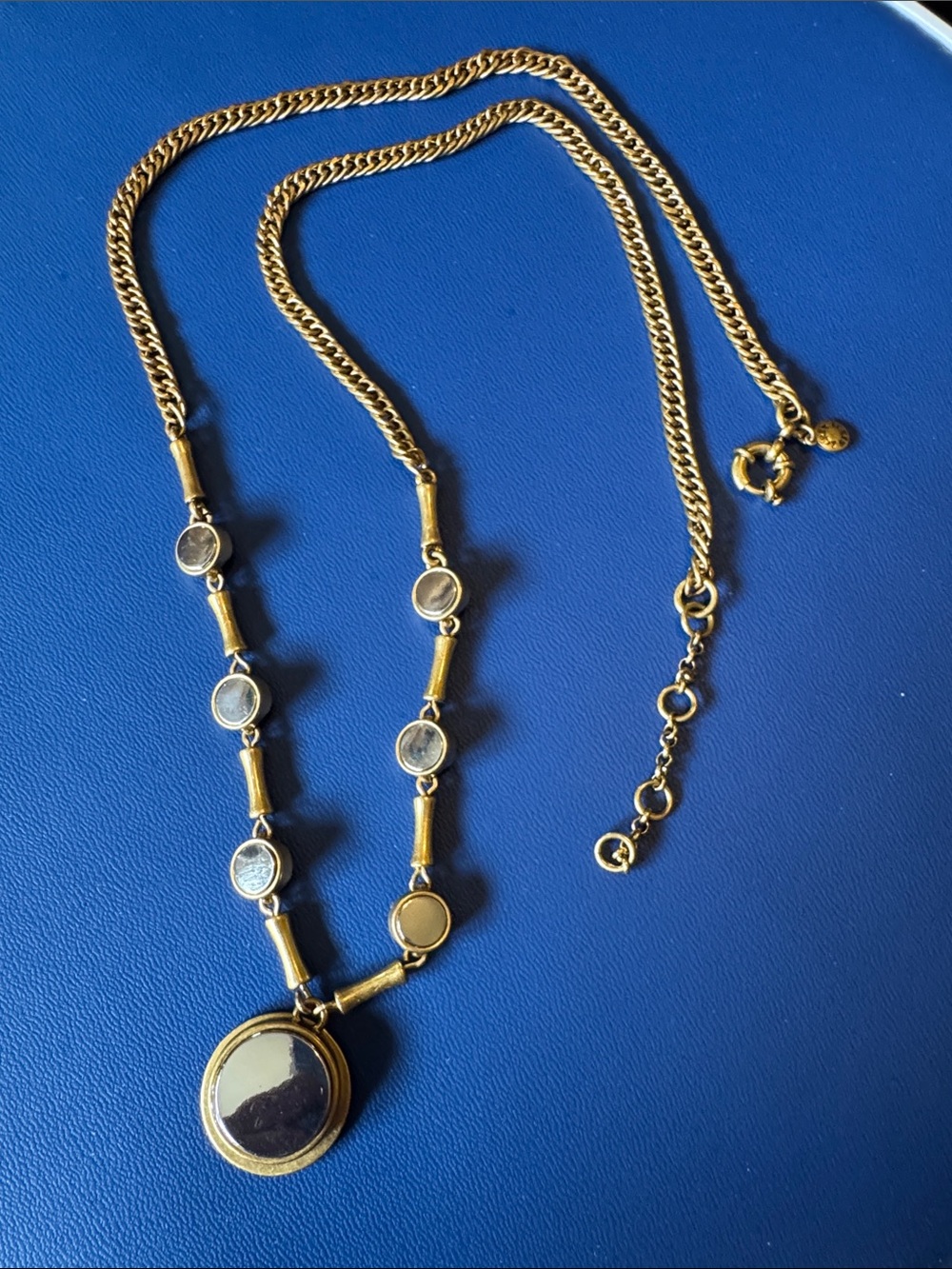 Lucky Brand long chain necklace featuring gold tone links&mirror like disks